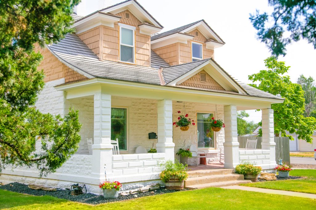 White and tan house that has followed many curb appeal tips